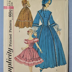 May include: A Simplicity 3294 sewing pattern envelope featuring illustrations of three dresses. One is a long blue dress with a bonnet, one is a long yellow patterned dress, and one is a short red and white gingham dress with puff sleeves.