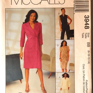May include: A McCall's sewing pattern featuring a woman in a pink double-breasted dress. The pattern includes options for dresses and a pantsuit. The pattern number is 3948, with size BB.