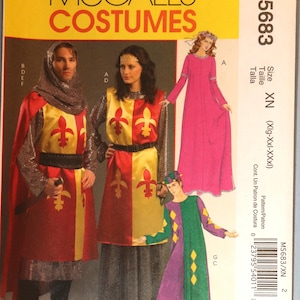 May include: McCall's Costumes sewing pattern M5683 in size XN. The envelope features illustrations of four medieval-style costumes: two tabards with red and yellow fleur-de-lis patterns, a long pink dress, and a green and purple jester outfit.