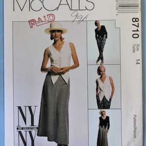 May include: McCall's sewing pattern featuring a woman in a white vest and gray skirt. The pattern includes multiple views of the outfit. The text "NY THE COLLECTION NY" is visible. The pattern size is 14.