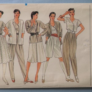 May include: Vogue Patterns sewing pattern envelope featuring illustrations of women's fashion designs. The designs include blazers, skirts, shorts, and pants. The envelope is labeled with the Vogue Patterns logo and the number 8246.