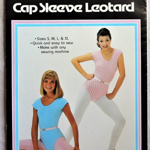 May include: A vintage sewing pattern for a cap sleeve leotard. The pattern features sizes S, M, L, and XL. The image shows two women wearing the leotard. The leotard is available in blue and pink, with a white belt. The text on the pattern says it is quick and easy to sew.