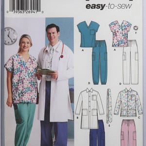 May include: Simplicity 5443 easy-to-sew pattern envelope featuring illustrations of medical scrubs, including V-neck tops, pants with pockets, and a lab coat. The cover displays a person in a floral top and teal pants, and another in a white lab coat.