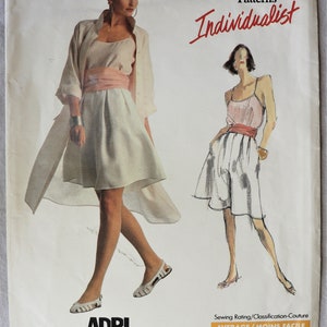May include: Vogue Patterns Individualist sewing pattern featuring a woman in a dress and jacket, and a sketch of a woman in shorts and a top. The pattern includes the word "ADRI" and the number 2036.