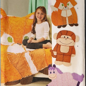 May include: Simplicity pattern 8278 features a fox, monkey, and horse design. The image shows a girl sitting on a fox-shaped quilt. The pattern includes instructions for creating stuffed animal shapes. The pattern is one size.