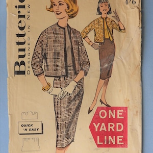 May include: A vintage Butterick sewing pattern envelope 9476 for a size 12, bust 32. The tan paper cover features illustrations of a two-piece outfit with a plaid jacket and skirt, and a second option with a leopard print jacket and solid skirt.