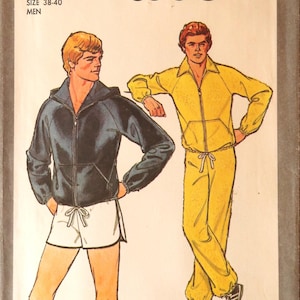 May include: Vintage Simplicity pattern 8360 featuring illustrations of athletic wear. The cover shows a man in a black hooded jacket and white shorts, and another in a yellow tracksuit. The size is medium, 38-40.