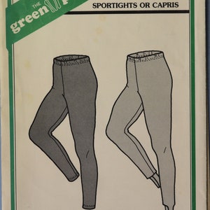May include: A sewing pattern envelope for The Green Pepper Inc. F757 Sportights or Capris. The front cover features black and white line drawings of two styles of leggings, one with a stirrup at the ankle, displayed against a cream background.