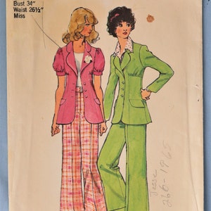 May include: Simplicity sewing pattern 5642 for size 12, featuring a bust of 34 inches and waist of 26.5 inches. The envelope displays illustrations of two outfits: a pink jacket with plaid pants and a solid green blazer with matching trousers.