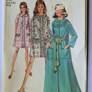 May include: Simplicity sewing pattern 8458 for size small 8-10 miss. The envelope features illustrations of three garments: a short pink floral dress, a short multi-colored floral coat with ruffled trim, and a long teal coat with a yellow rope belt.