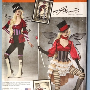May include: Simplicity pattern 1301 for fantasy costumes. The pattern features a woman in a red and black outfit with a corset, striped stockings, and a top hat. The image includes a small framed illustration of the costume.