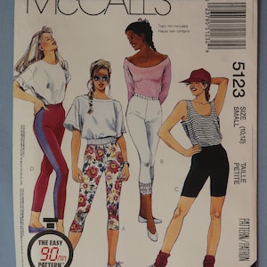 May include: McCall's sewing pattern envelope featuring illustrations of athletic wear. The cover includes images of leggings, shorts, and tops. The text reads "The Easy 90 min Pattern" and "Focus on Overlock (Serger) Sewing."