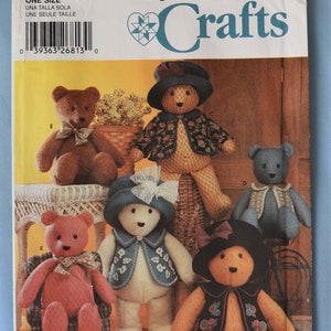 May include: A Simplicity Crafts sewing pattern envelope 5461 featuring illustrations of six different teddy bears. The bears are shown wearing various outfits including hats, jackets, and bows. The text includes the brand name Simplicity and Crafts.