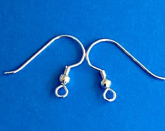May include: Two silver earring hooks with a small ball at the end of each hook.
