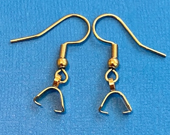 May include: A pair of gold-toned earring hooks with a small loop at the bottom. The hooks are made of metal and have a shiny finish.