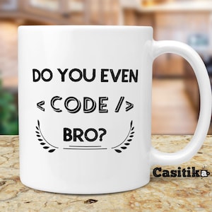 May include: White ceramic coffee mug with black text that reads "Do you even <CODE/> bro?" with a decorative flourish on either side of the text. The mug has a black handle and the word "Casitika" is printed on the bottom right side of the mug.