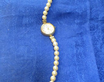 Avon one strand pearl and gold finish wrist watch 1990's