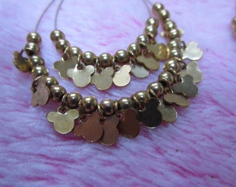 Shimmery Gold earrings with multiple mickey mouse cutouts