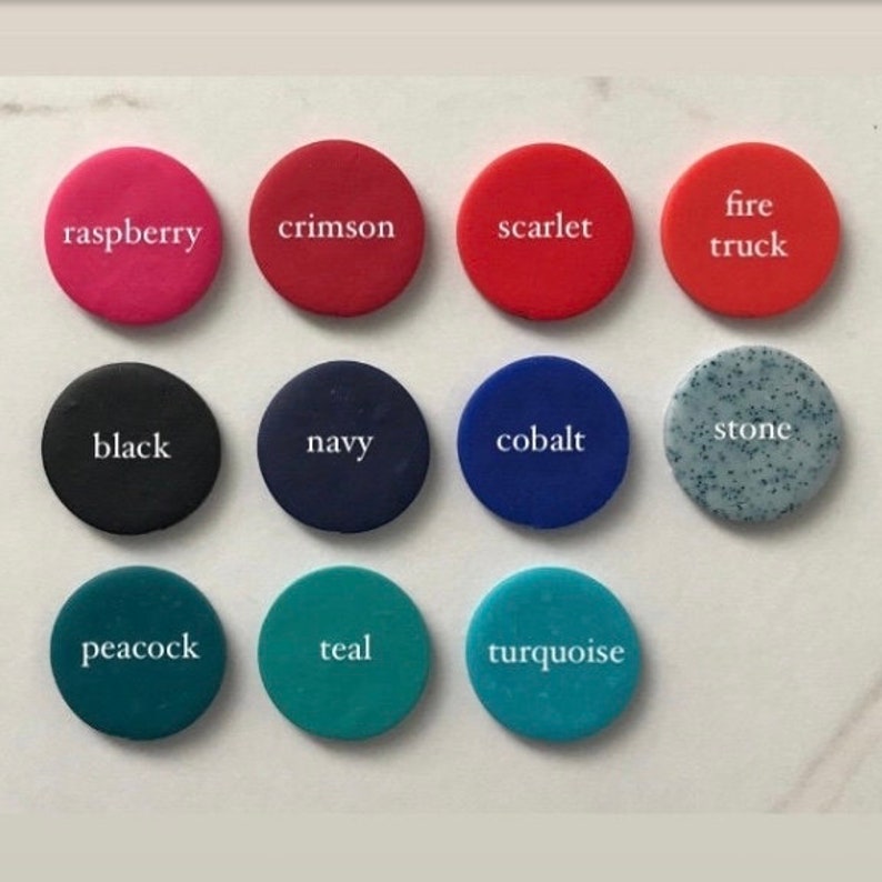 May include: A set of 12 color swatches, each with a different color name printed in white. The colors include raspberry, crimson, scarlet, fire truck, black, navy, cobalt, stone, peacock, teal, turquoise.