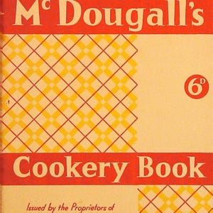 May include: A vintage McDougall's Cookery Book with a cream-colored cover featuring a yellow and red checkered pattern. The text reads McDougall's Cookery Book, 6D, and Issued by the Proprietors of McDougall's Self-Raising Flour in red lettering.