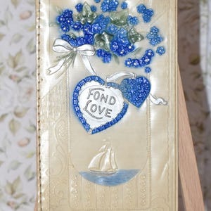 Carte de Noël édouardienne en celluloïd - magnifiques fleurs myosotis - Fond Love