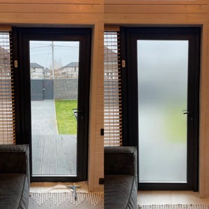 May include: Before and after images of a frosted window film being applied to a glass door. The door is black and has a handle. The door is in a room with wood panelling and blinds.