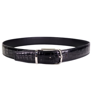 Black leather belt with silver-tone buckle, featuring glossy crocodile-style texture, rounded edges, and stitched detailing, displayed in a circular form on a white background.