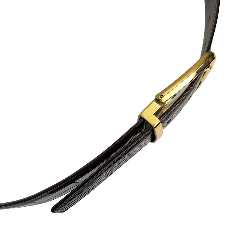 May include: A brown leather belt with a gold buckle. The belt is folded in half and the buckle is visible.