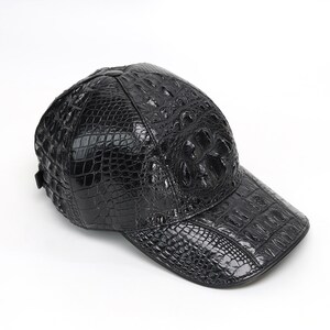 Side view of handmade alligator cap showing natural scale texture and structured shape.