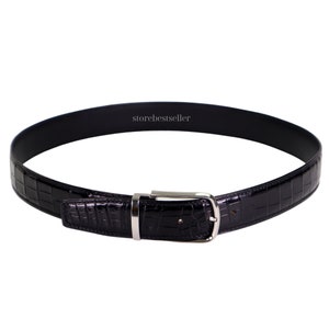 May include: A black leather belt with a crocodile pattern and a silver buckle. The belt is made of genuine leather and is a stylish accessory for any man.