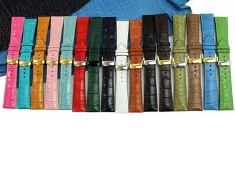 May include: A collection of fifteen watch straps featuring a textured crocodile-embossed pattern in various colours including pink, turquoise, orange, red, green, black, white, brown, and lime, each equipped with a polished metal buckle.