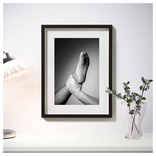 Framed photos, hand with foot, fetish, furniture photos, black and white photography