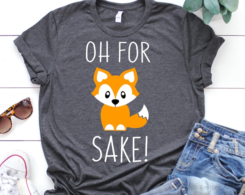 May include: Gray t-shirt with a white graphic of a cartoon fox and the text "OH FOR SAKE!"