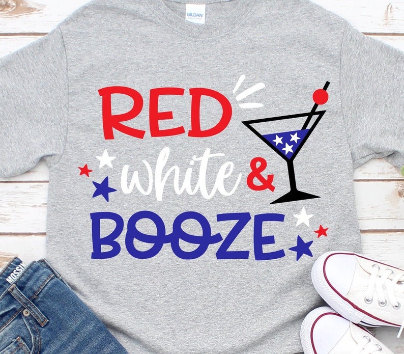 May include: Gray t-shirt with the text "RED, white & BOOZE" in red, white, and blue lettering. A martini glass with red, white, and blue stars is next to the text.