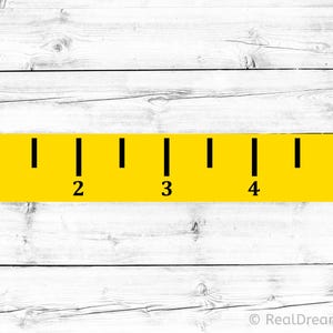 May include: A yellow ruler with black markings and numbers 1 through 5. The ruler is set against a white wooden background. The ruler is a simple design, perfect for measuring items.
