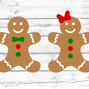 May include: Two gingerbread people, one with a red bow and the other with a green bow tie. Both have green and red buttons.