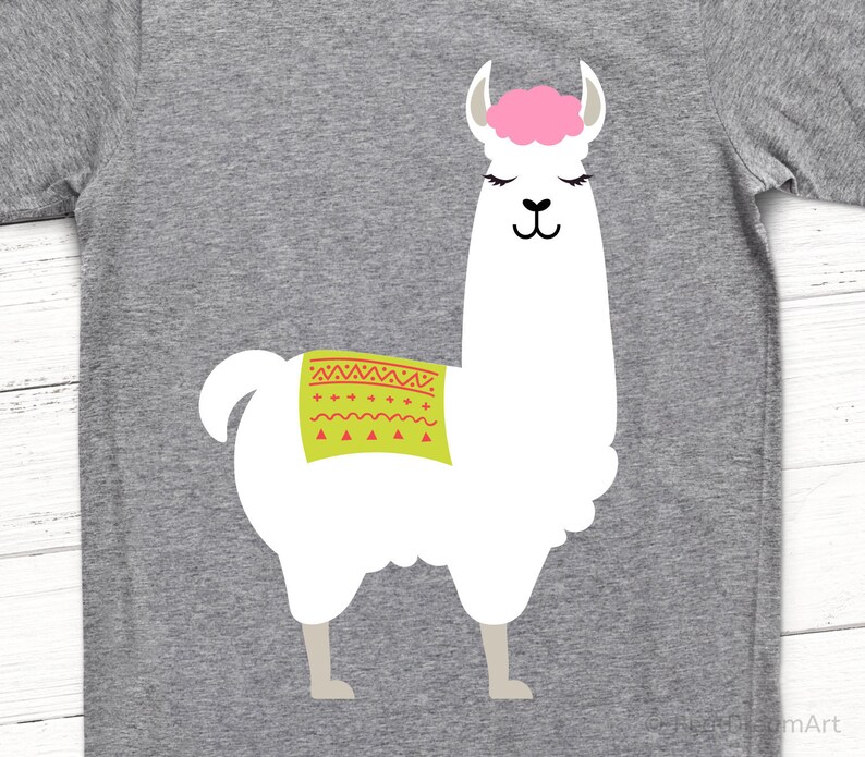 May include: A white llama with a pink head and a green and red patterned saddle. The llama is standing on a gray background.