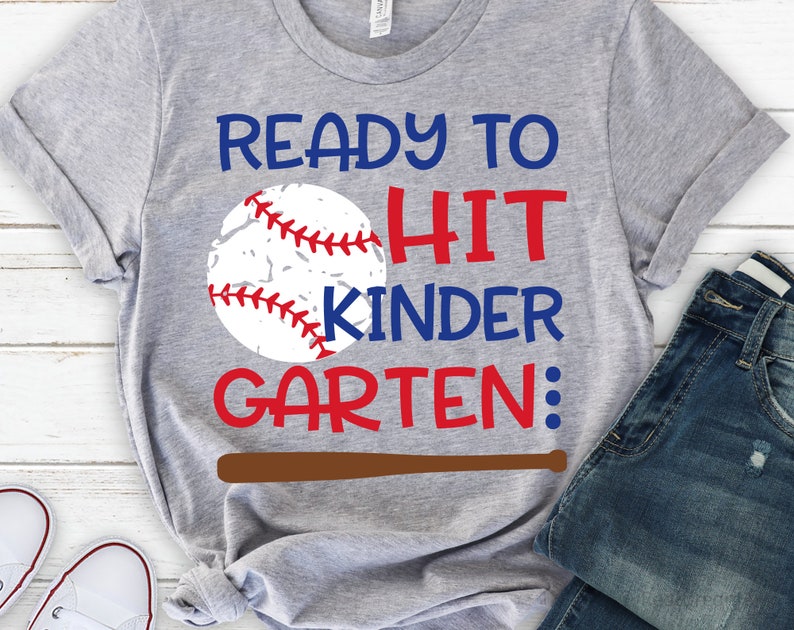 May include: Grey t-shirt with a baseball graphic and the text "Ready to Hit Kindergarten".