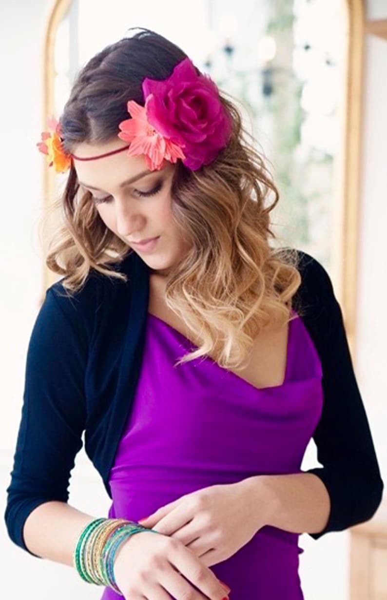 Bolero lightweight jacket, 3/4 sleeves, perfect over sleeveless dresses for arm coverage and shoulder  warmth. Colours come in black, white and navy, in sizes small, medium, large and Xlarge. Easily stored in a clutch bag, when not being worn.