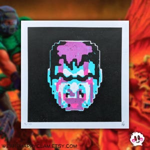 May include: A black and white print of a pixelated character with pink and blue accents. The print is on a white background and has the number 5/10 printed in the bottom left corner.