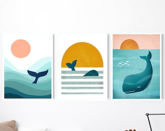 May include: Three framed prints with a nautical theme. Each print features a whale with a blue and teal colour scheme. The top print shows a whale tail, the middle print shows a whale swimming, and the bottom print shows a whale with a sunset in the background.