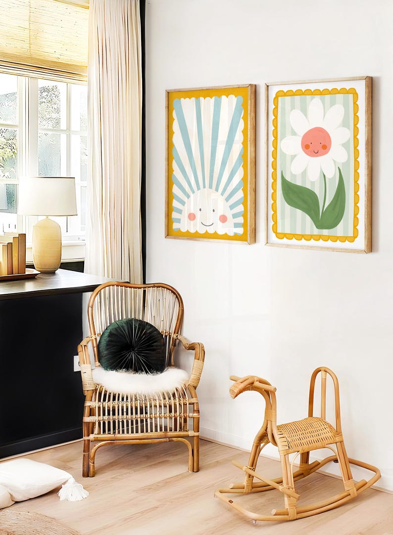 May include: Two framed illustrations with a yellow border. The first illustration shows a blue and white striped background with a smiling sun. The second illustration shows a white daisy with a smiling face on a green and white striped background.
