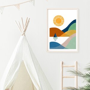 May include: A framed abstract print of a stylized landscape with a sun, hills, and a sailboat on a body of water. The colors are blue, green, yellow, orange, and brown.