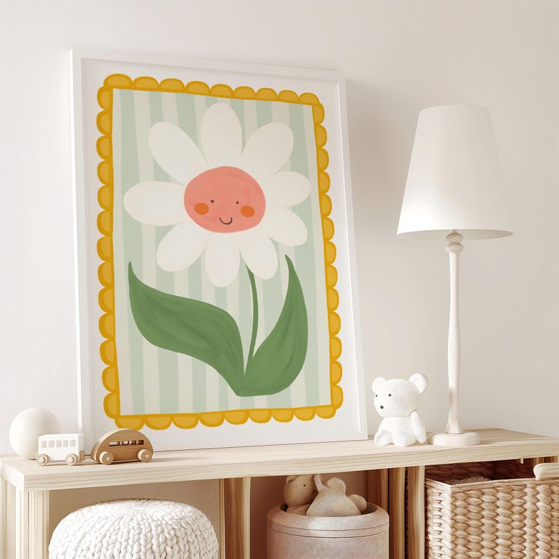 May include: A white daisy with a pink center and a smiling face is illustrated on a light blue and white striped background. The daisy is surrounded by a yellow scalloped frame.