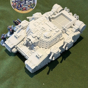 May include: An unpainted off-white miniature tank model with intricate mechanical details, including a turret, side cannons, and rear engine vents. Beside the tank are three small painted soldier figurines. A circular logo reads Weeze Prints.