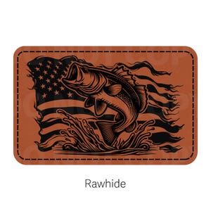 May include: A brown leather patch with a black silhouette of a bass jumping out of the water with an American flag in the background. The text "Rawhide" is printed below the image.