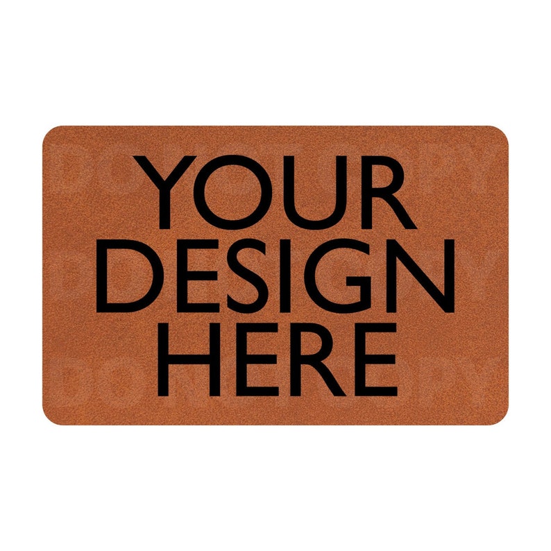 以下が含まれることがあります： 黒い文字で「YOUR DESIGN HERE」と印刷された茶色の玄関マットです。