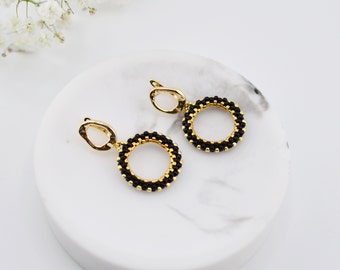 Statement hoop earrings. Black and 24K gold beads. Beadwork Earrings. Handcrafted dangle beaded earrings. Gift ideas