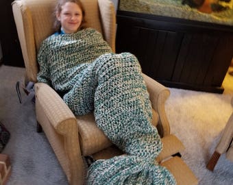 Handmade crochet dolphin tale afghan.