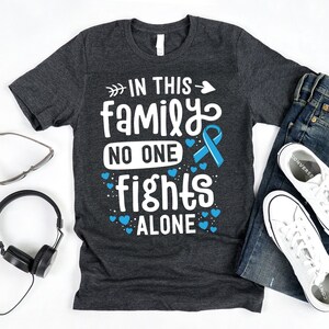 In This Family No One Fights Alone T-Shirt / Prostate Cancer Shirt / Blue Ribbon / No One Fights Alone / In This Family / Cancer Fighter